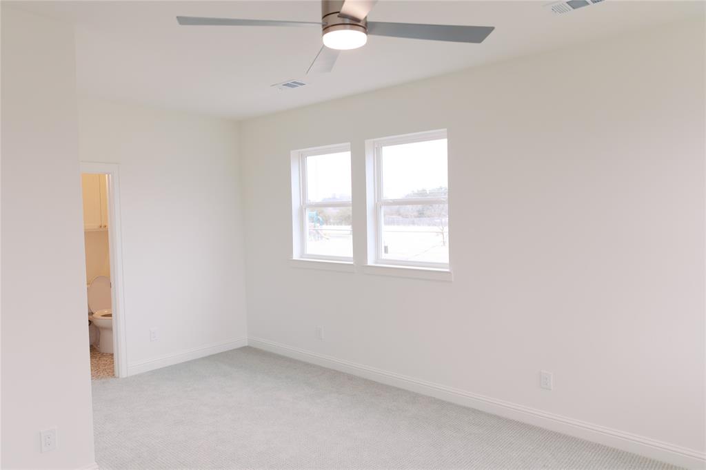 10930 Beauty Lane Dallas, TX 75229 - Photo 16 of 27 an empty room with a window