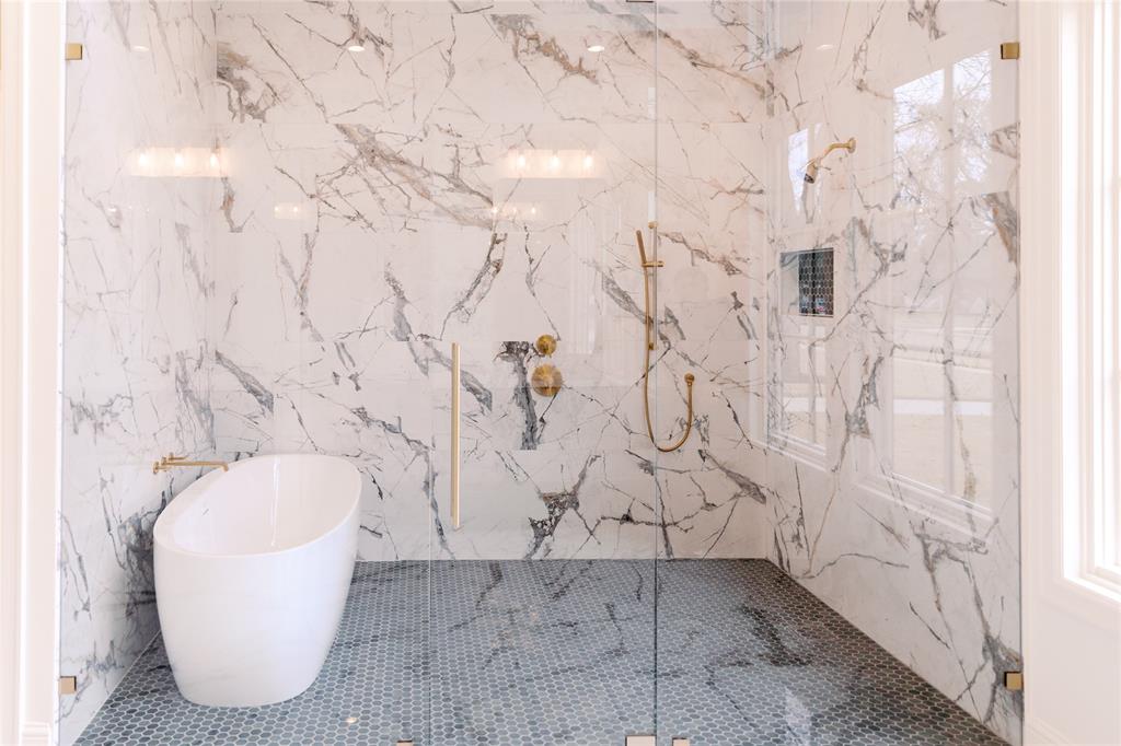 10930 Beauty Lane Dallas, TX 75229 - Photo 17 of 27 a bathroom with a bathtub and shower