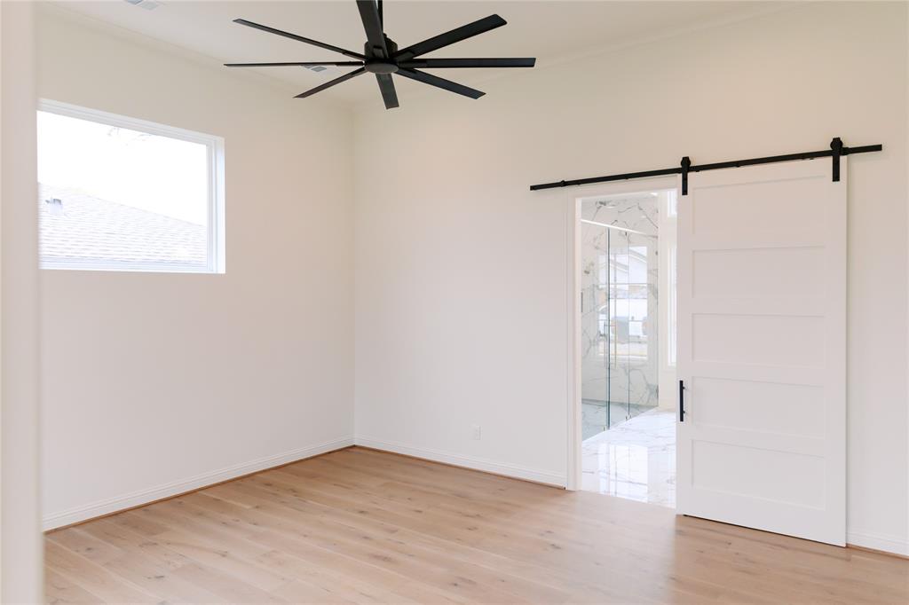 10930 Beauty Lane Dallas, TX 75229 - Photo 21 of 27 a view of a room with wooden floor and windows