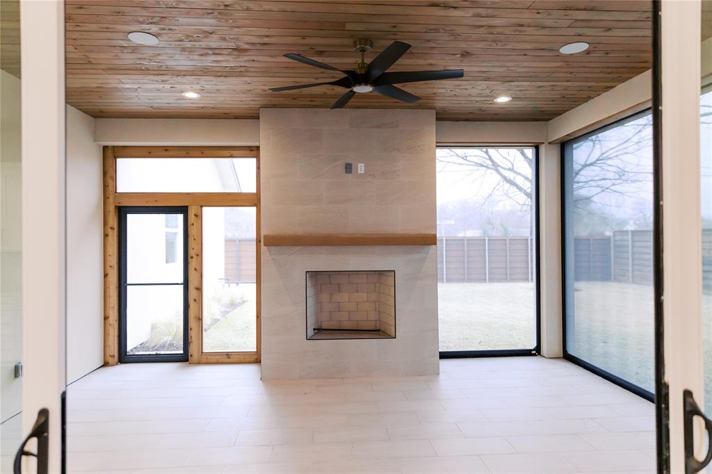 10930 Beauty Lane Dallas, TX 75229 - Photo 24 of 27 a view of an empty room with a fireplace and a window