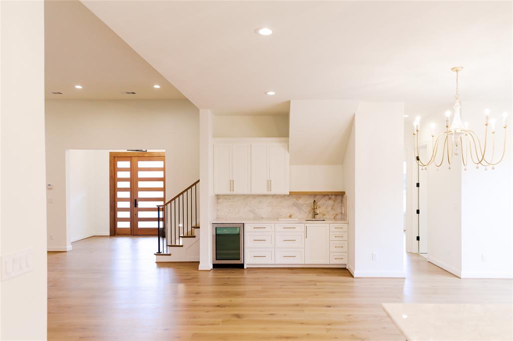 10930 Beauty Lane Dallas, TX 75229 - Photo 3 of 27 a view of a kitchen with a sink and dishwasher a oven with wooden floor