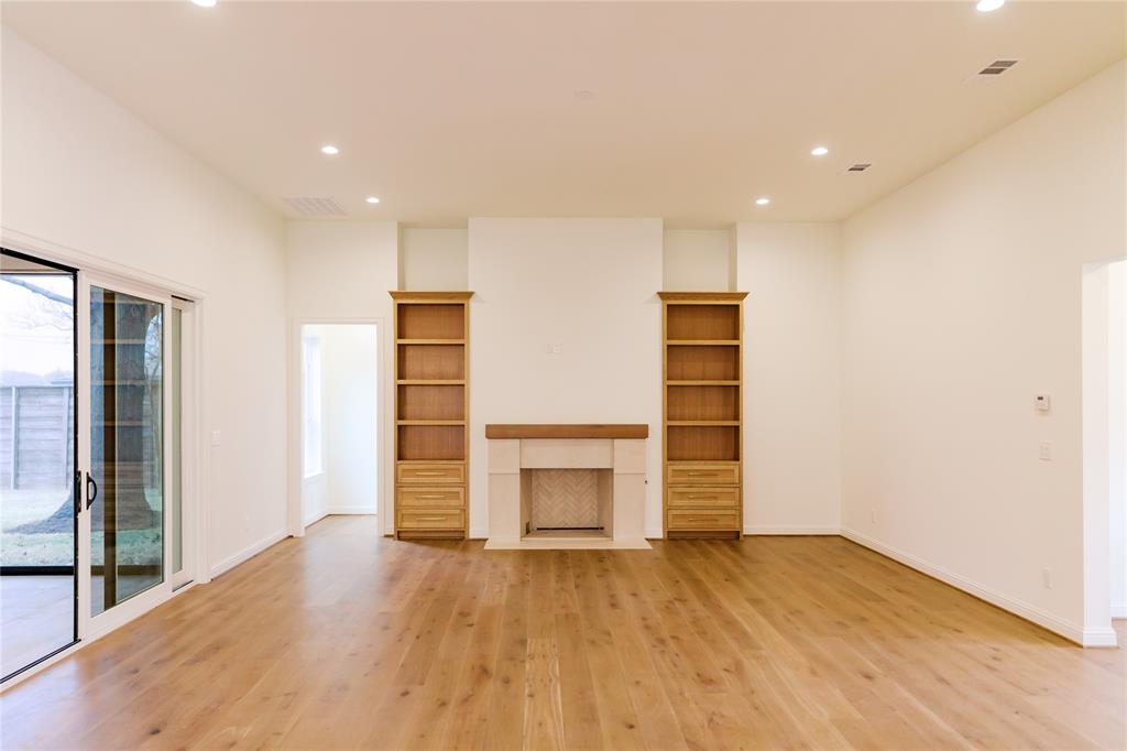 10930 Beauty Lane Dallas, TX 75229 - Photo 10 of 27 an empty room with wooden floor closet and windows