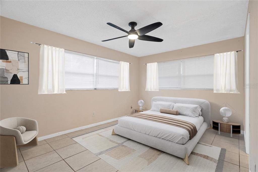 10 Kepner Street Orlando, FL 32839 - Photo 13 of 26 a bedroom with a bed and window