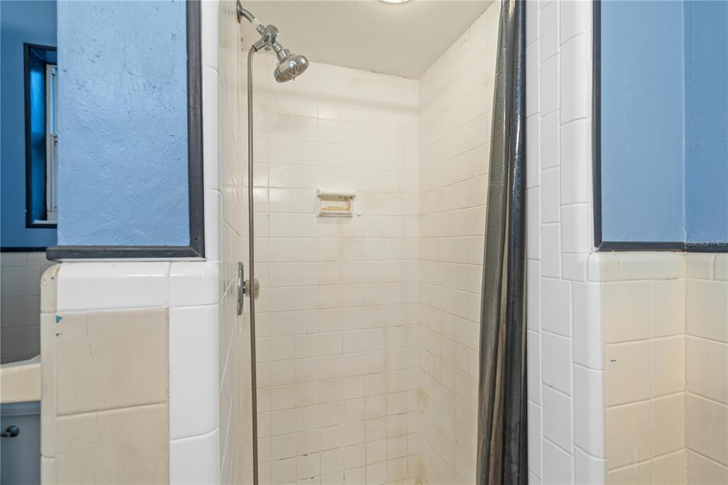 10 Kepner Street Orlando, FL 32839 - Photo 16 of 26 a bathroom with a shower