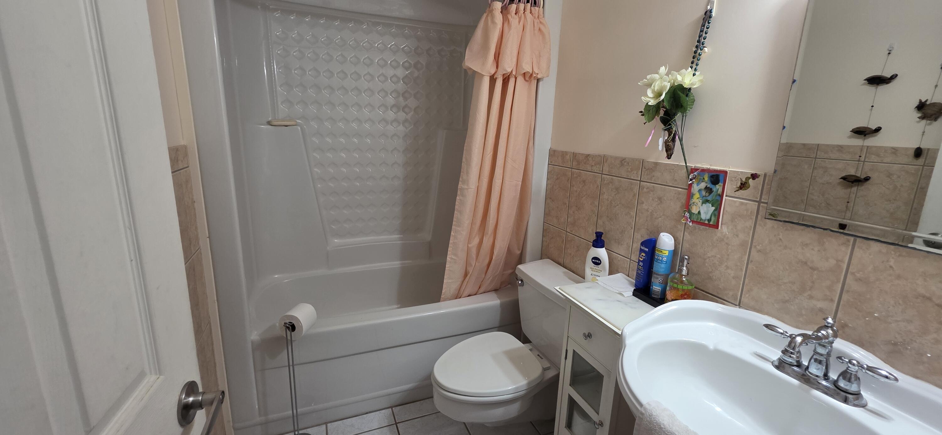 8 Emerald Drive Key West, FL 33040 - Photo 27 of 43 a white toilet sitting next to a bath tub