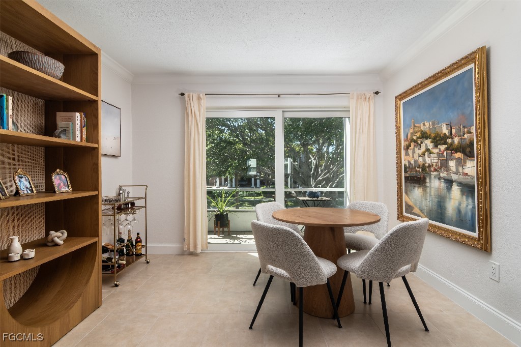 72 7th Street South, Unit 206 Naples, FL 34102 - Photo 3 of 10 a dining room with furniture and a window