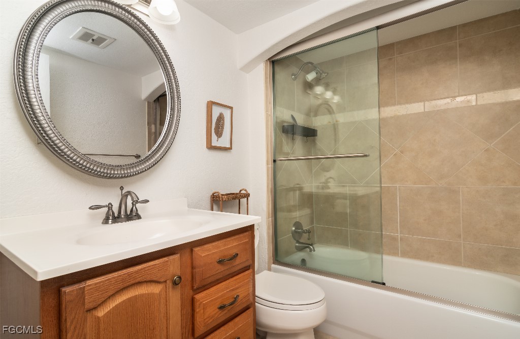 72 7th Street South, Unit 206 Naples, FL 34102 - Photo 7 of 10 a bathroom with a sink toilet and shower