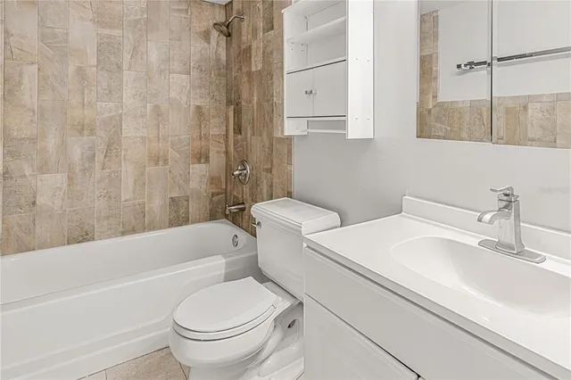 a bathroom with a sink a toilet and a bathtub