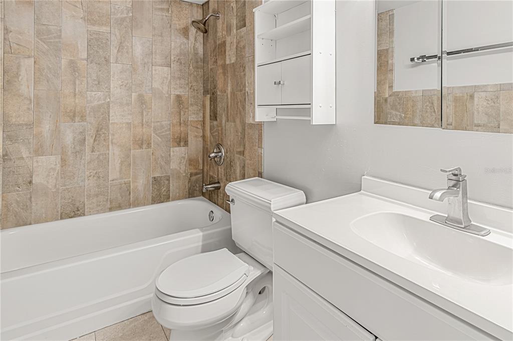 640 North Nova Road, Unit 409 Ormond Beach, FL 32174 - Photo 14 of 33 a bathroom with a sink a toilet and a bathtub