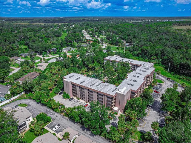 an aerial view of a house with a garden