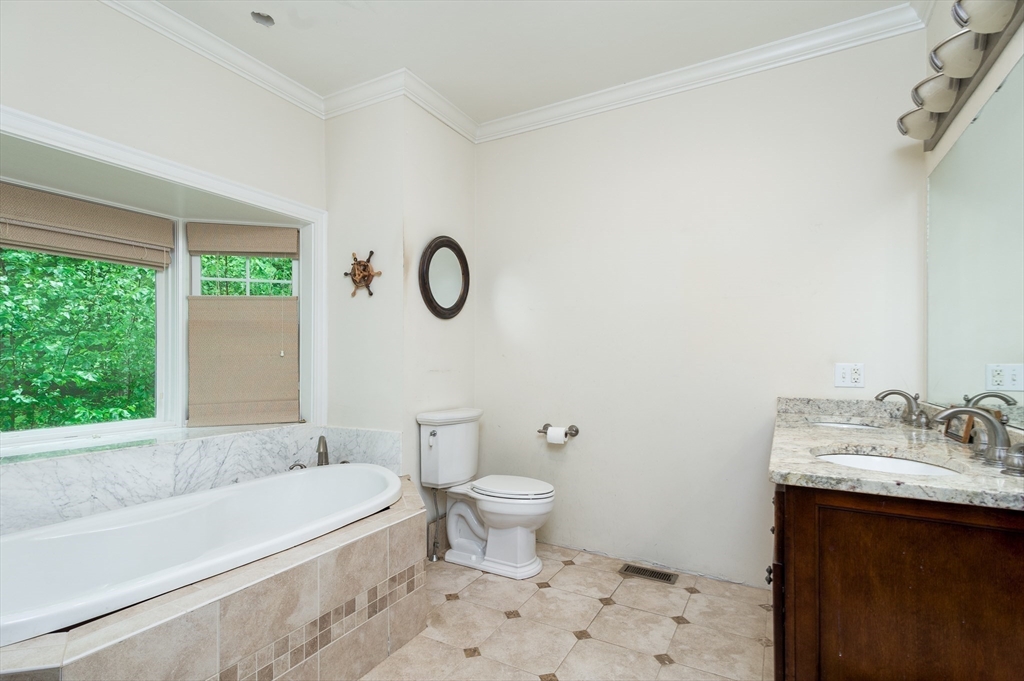 150 Packard Hill Road Ashburnham, MA 01430 - Photo 14 of 31 a bathroom with a sink a toilet and a bathtub