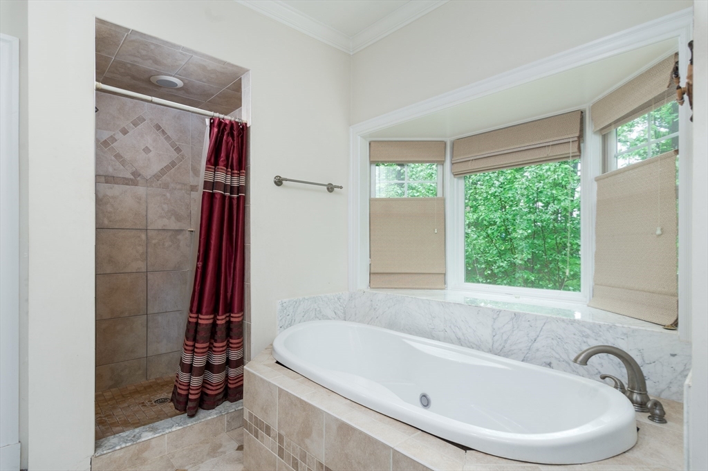 150 Packard Hill Road Ashburnham, MA 01430 - Photo 15 of 31 a white bath tub sitting next to a window