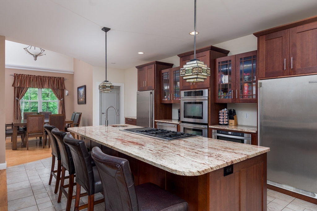 150 Packard Hill Road Ashburnham, MA 01430 - Photo 4 of 31 a kitchen with a table and chairs in it