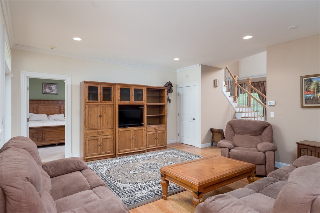 150 Packard Hill Road Ashburnham, MA 01430 - Photo 8 of 31 a living room with furniture a rug and kitchen view
