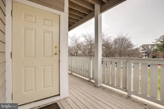 a view of a balcony with wooden floor