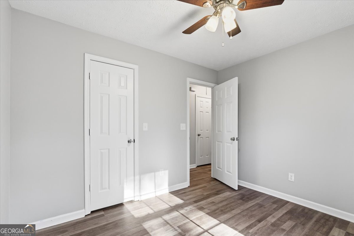 93 Robin Hood Road Covington, GA 30014 - Photo 13 of 20 a view of an empty room and window chandelier fan