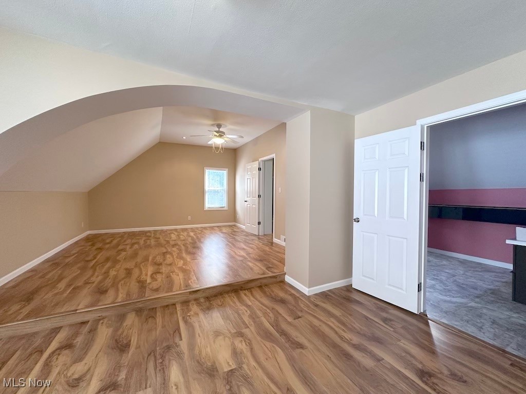 6846 Ottawa Road Cleveland, OH 44105 - Photo 32 of 50 Additional living space featuring lofted ceiling, wood finished floors, baseboards, and ceiling fan