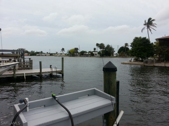 2606 Second Street Cape Coral, FL 33993 - Photo 12 of 24 a view of a lake with sitting area