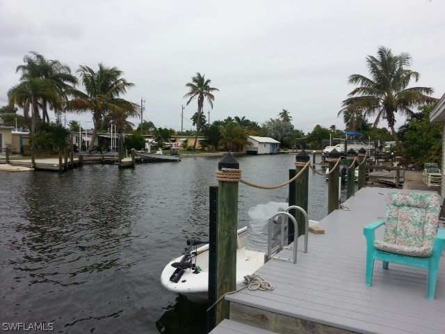 2606 Second Street Cape Coral, FL 33993 - Photo 13 of 24 a view of a lake with boats and palm trees