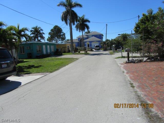 2606 Second Street Cape Coral, FL 33993 - Photo 2 of 24 a view of outdoor space with garden and tree