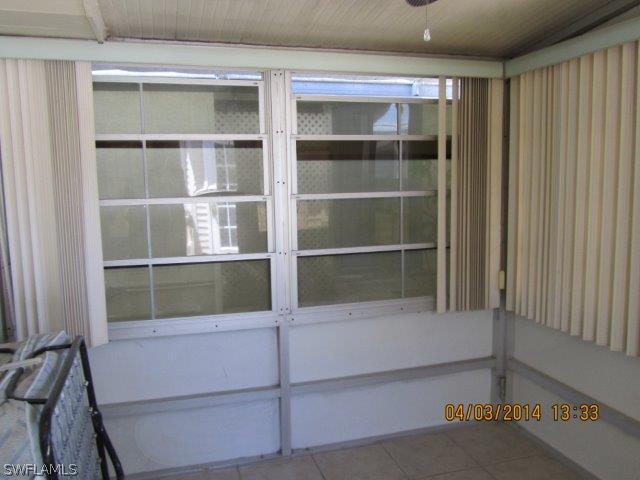 2606 Second Street Cape Coral, FL 33993 - Photo 22 of 24 a room with cabinets and a window