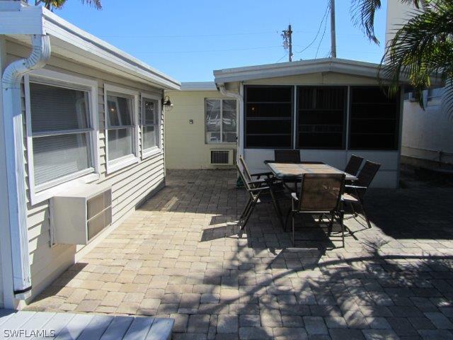 2606 Second Street Cape Coral, FL 33993 - Photo 6 of 24 a view of a patio with table and chairs and potted plants