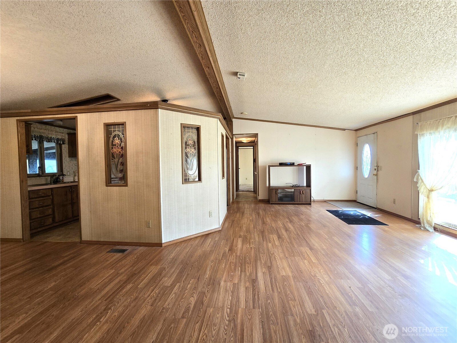 520 North 3rd Street Elma, WA 98541 - Photo 11 of 28 a big room with wooden floor and windows