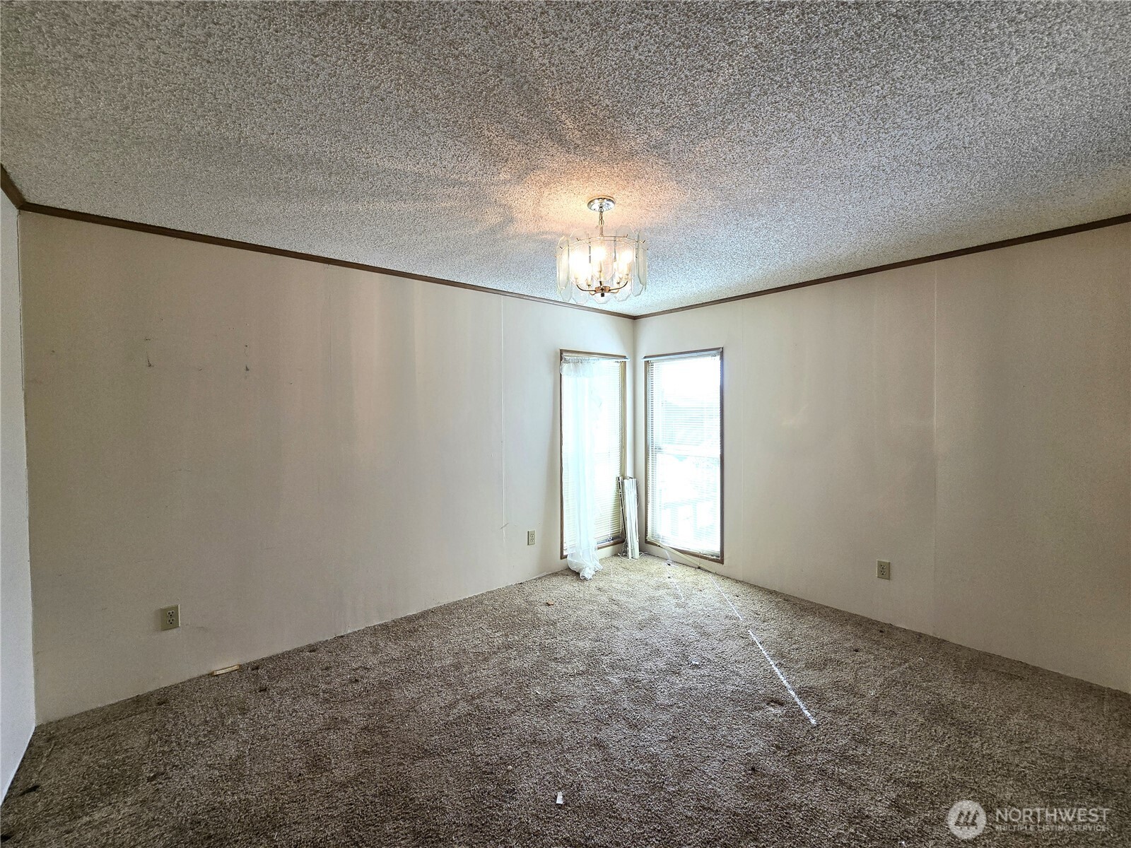 520 North 3rd Street Elma, WA 98541 - Photo 18 of 28 a view of an empty room and chandelier fan