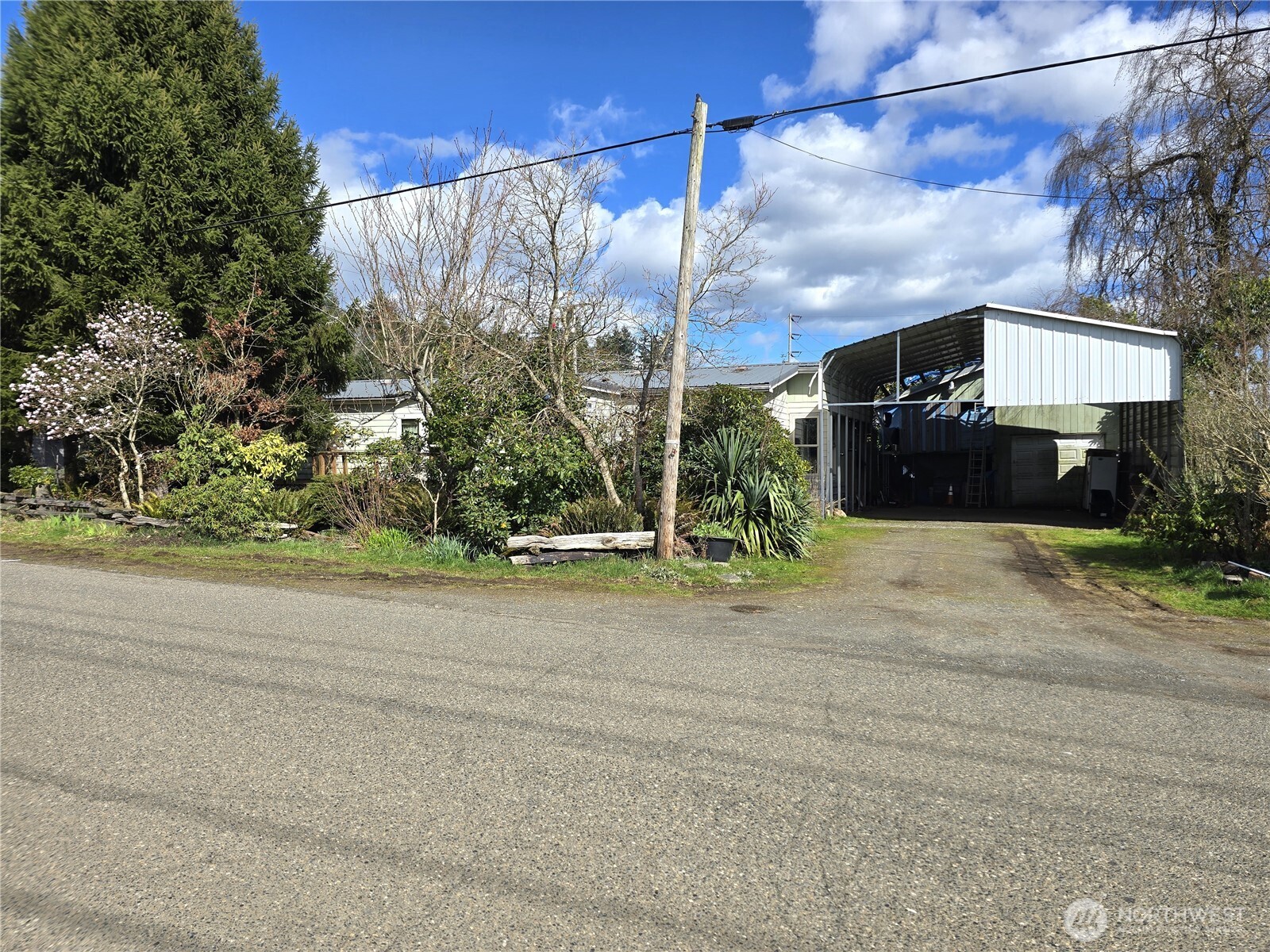 520 North 3rd Street Elma, WA 98541 - Photo 3 of 28 a street view with wooden fence