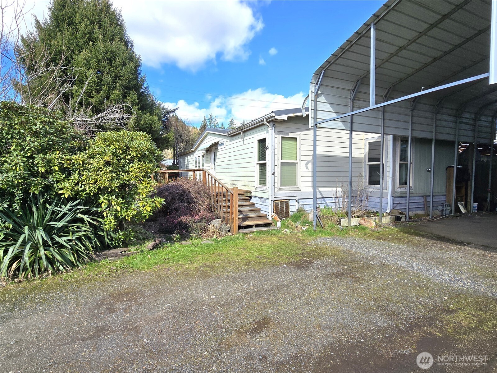 520 North 3rd Street Elma, WA 98541 - Photo 4 of 28 a view of a house with a yard and pathway