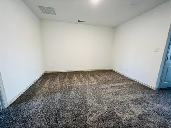 an empty room with a bench