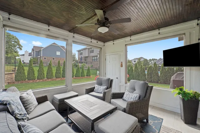 a outdoor space with patio couch and a potted plant