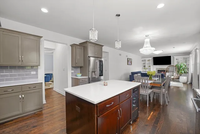 a large kitchen with a table and chairs