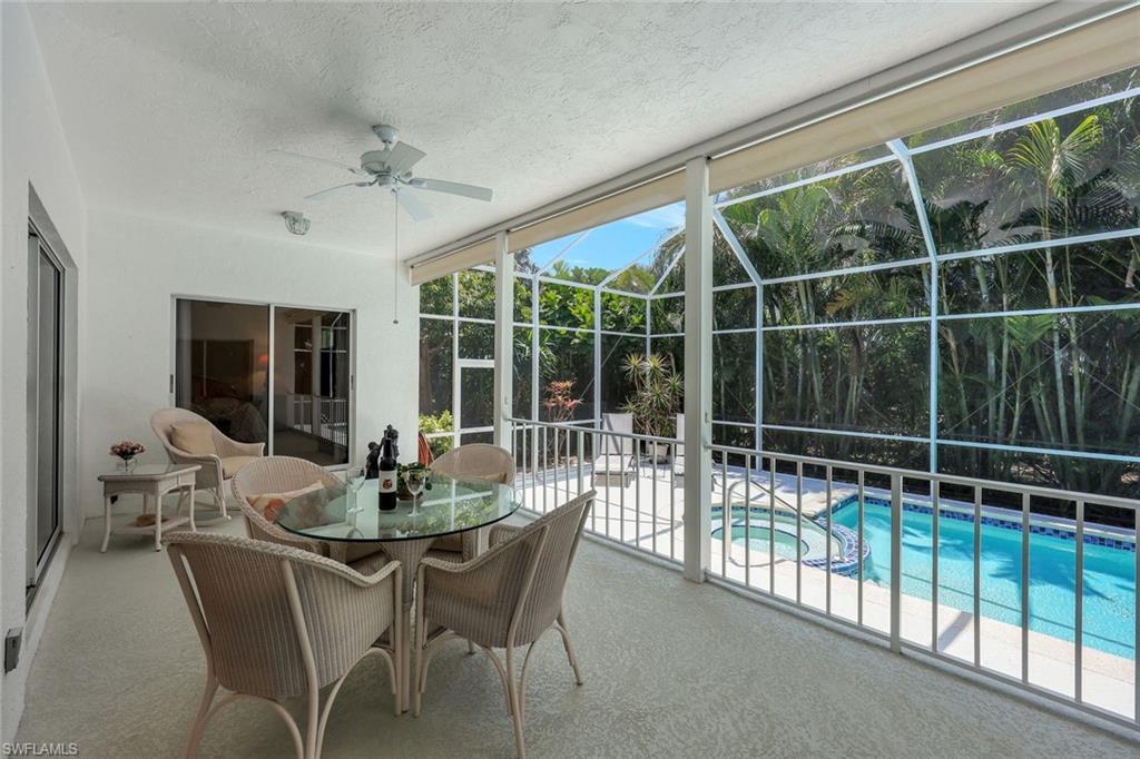5929 Chanteclair Drive, Unit 8 Naples, FL 34108 - Photo 3 of 28 Sunroom with a ceiling fan and a jacuzzi