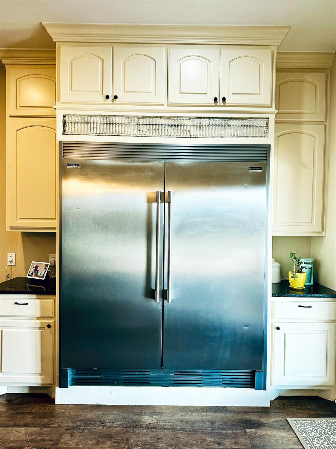 986 County Road 224 Post, TX 79356 - Photo 13 of 42 a kitchen with a refrigerator and cabinets