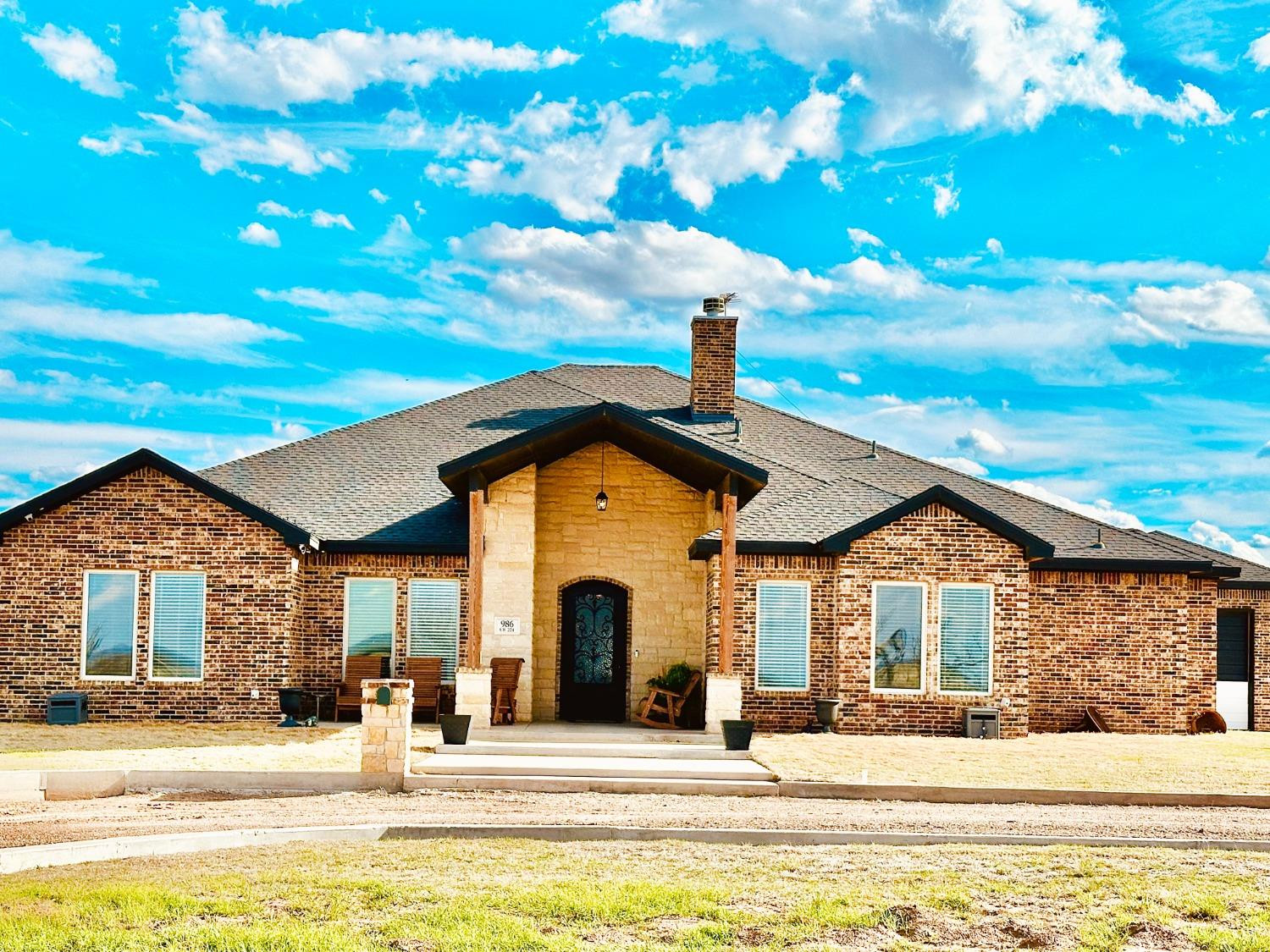 986 County Road 224 Post, TX 79356 - Photo 2 of 42 a front view of a house with a yard
