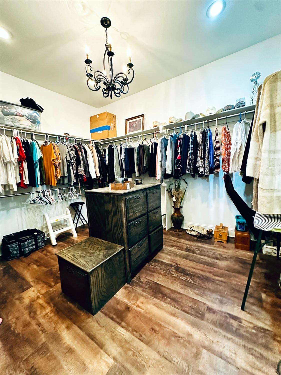 986 County Road 224 Post, TX 79356 - Photo 23 of 42 a living room with lots of furniture and a chandelier
