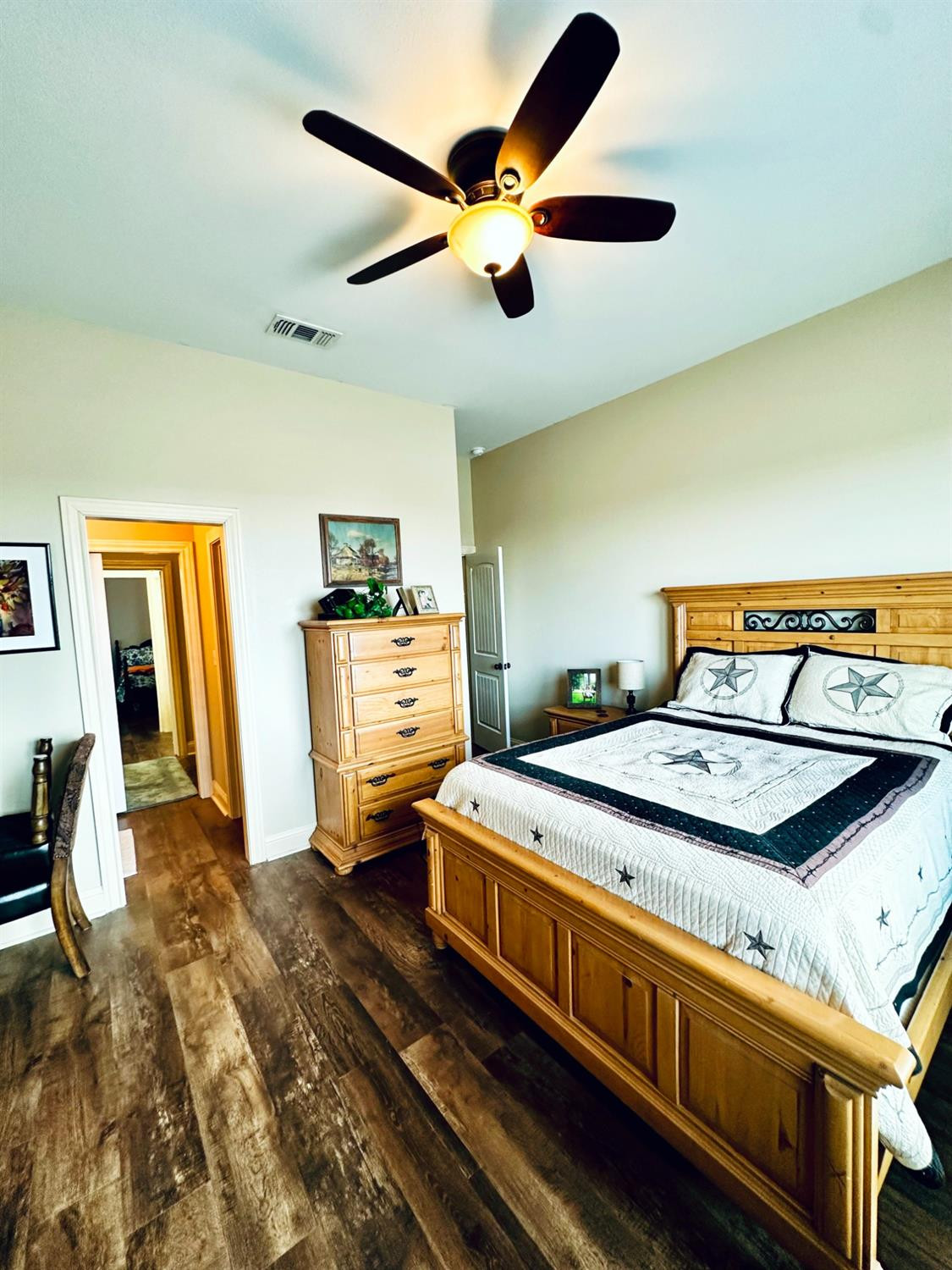 986 County Road 224 Post, TX 79356 - Photo 24 of 42 a bedroom with bed and wooden floor