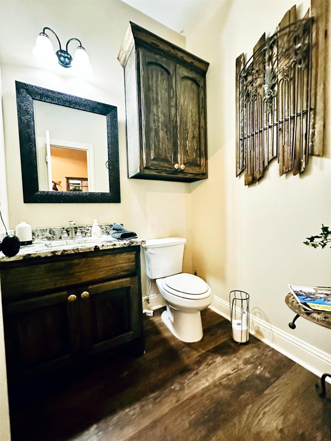 986 County Road 224 Post, TX 79356 - Photo 29 of 42 a bathroom with a toilet sink and mirror