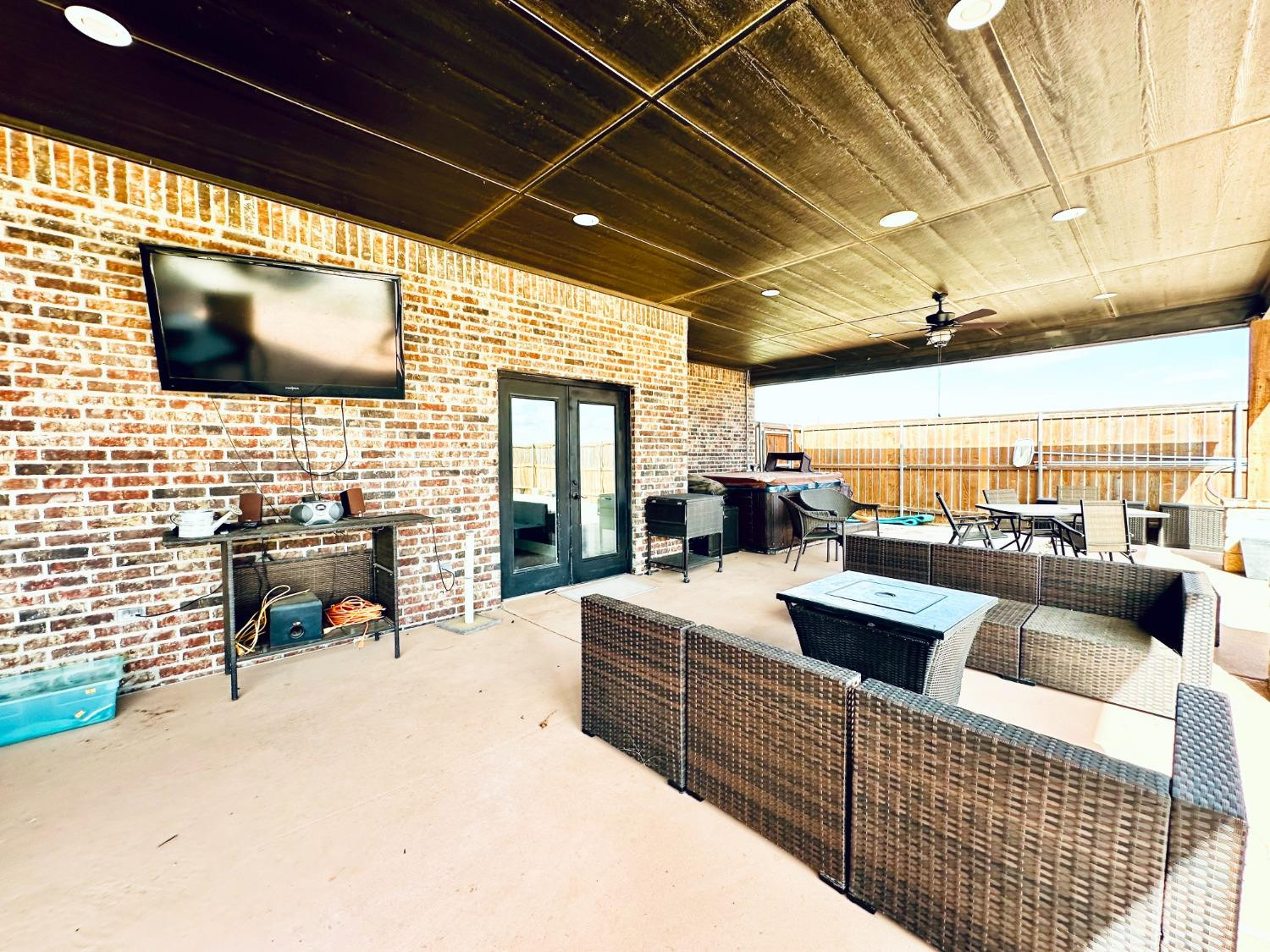 986 County Road 224 Post, TX 79356 - Photo 30 of 42 a outdoor living space with patio furniture and a flat screen tv