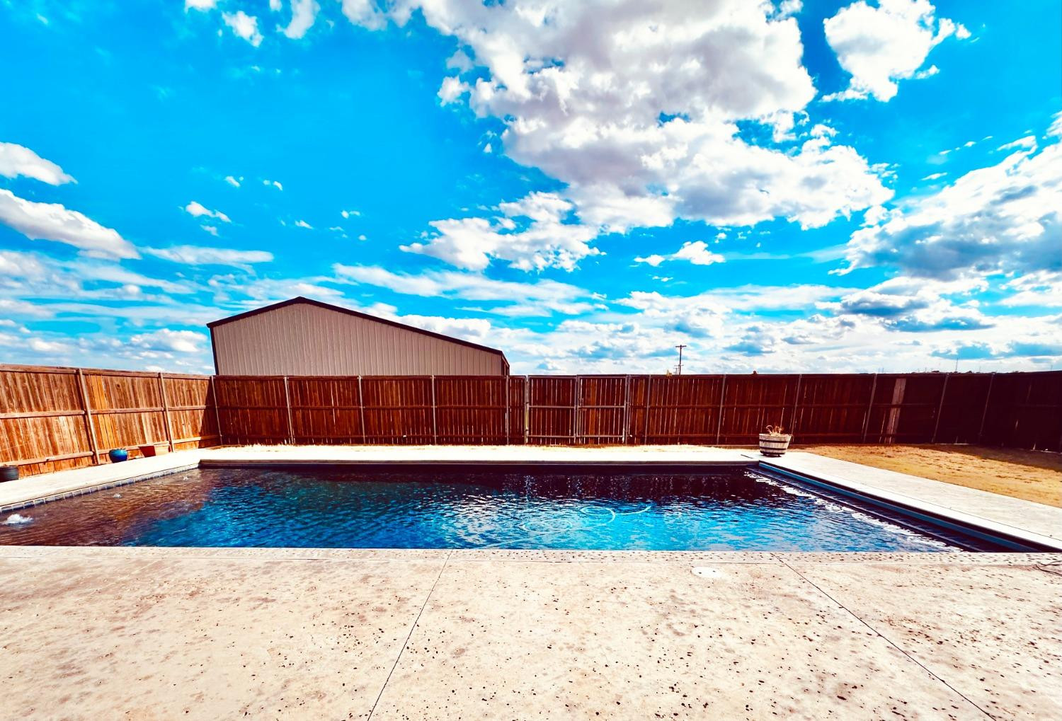 986 County Road 224 Post, TX 79356 - Photo 33 of 42 a view of backyard with swimming pool and outdoor seating