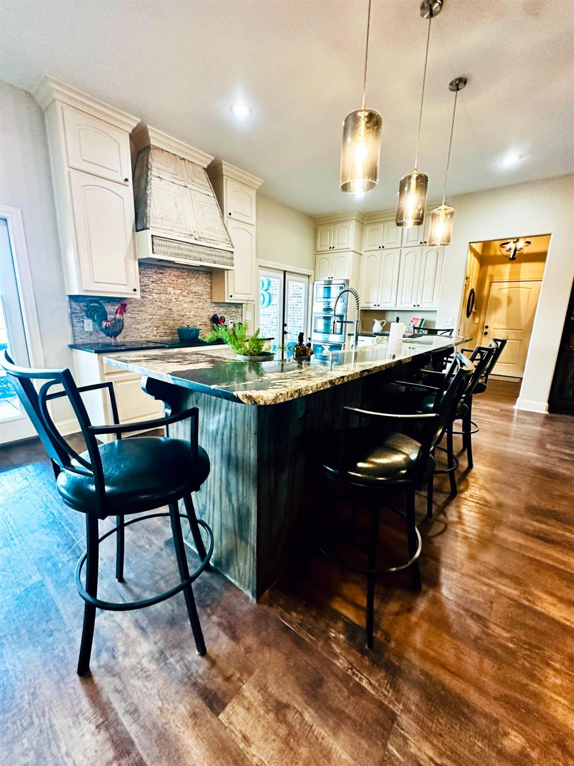 986 County Road 224 Post, TX 79356 - Photo 10 of 42 a kitchen with a table and chairs in it