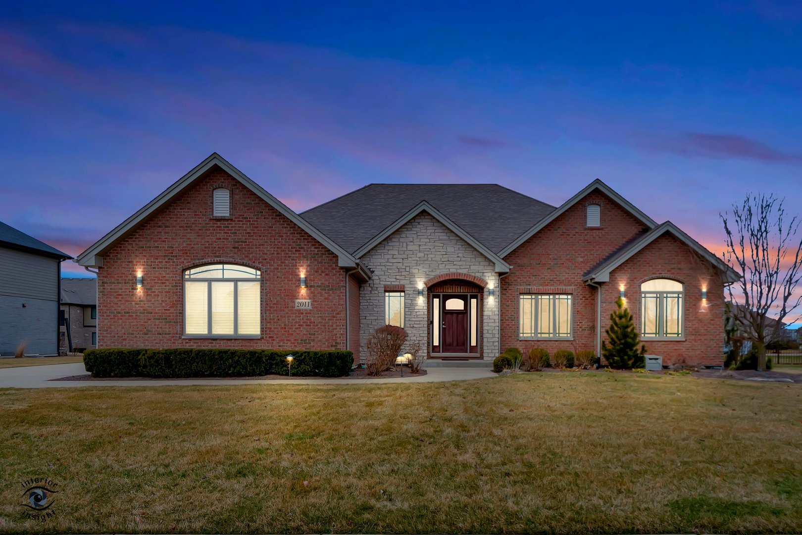 a front view of a house with a yard