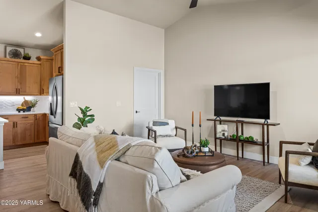 a living room with furniture and a flat screen tv