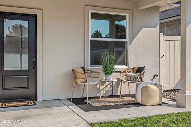a dining room with table and chairs