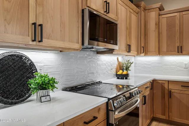 a kitchen with a sink and a stove top oven