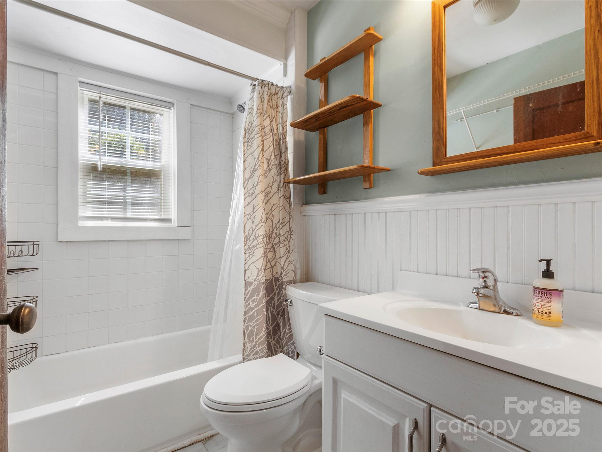 689 Bald Mountain Road Burnsville, NC 28714 - Photo 14 of 21 a bathroom with a sink a toilet and shower