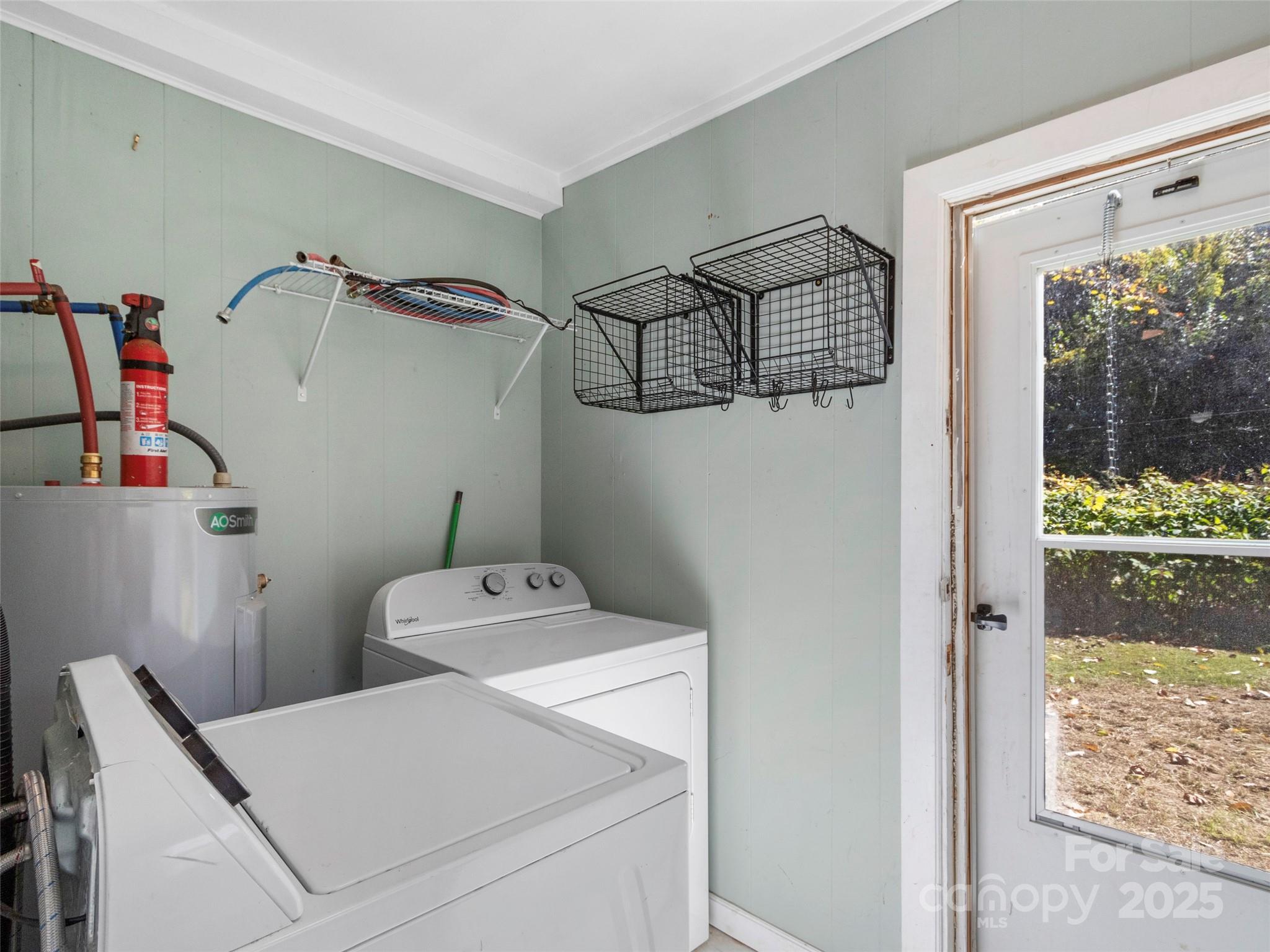 689 Bald Mountain Road Burnsville, NC 28714 - Photo 17 of 21 a utility room with dryer and washer