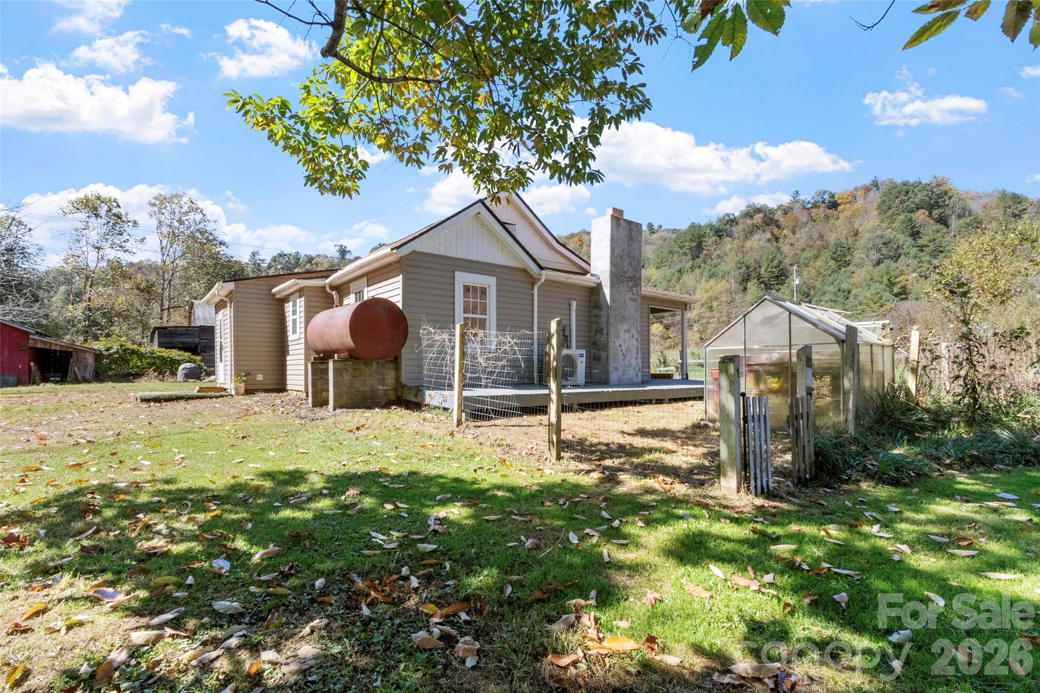689 Bald Mountain Road Burnsville, NC 28714 - Photo 20 of 21 a view of a house with backyard