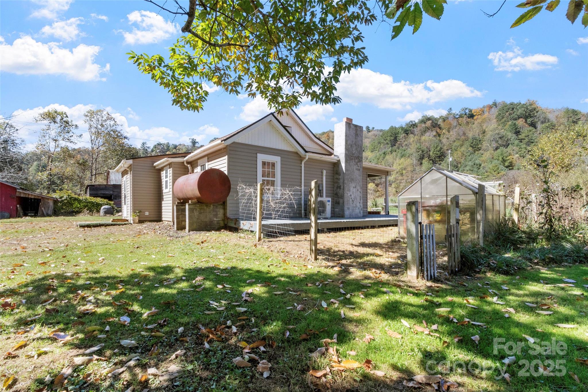 689 Bald Mountain Road Burnsville, NC 28714 - Photo 20 of 21 a view of a house with backyard